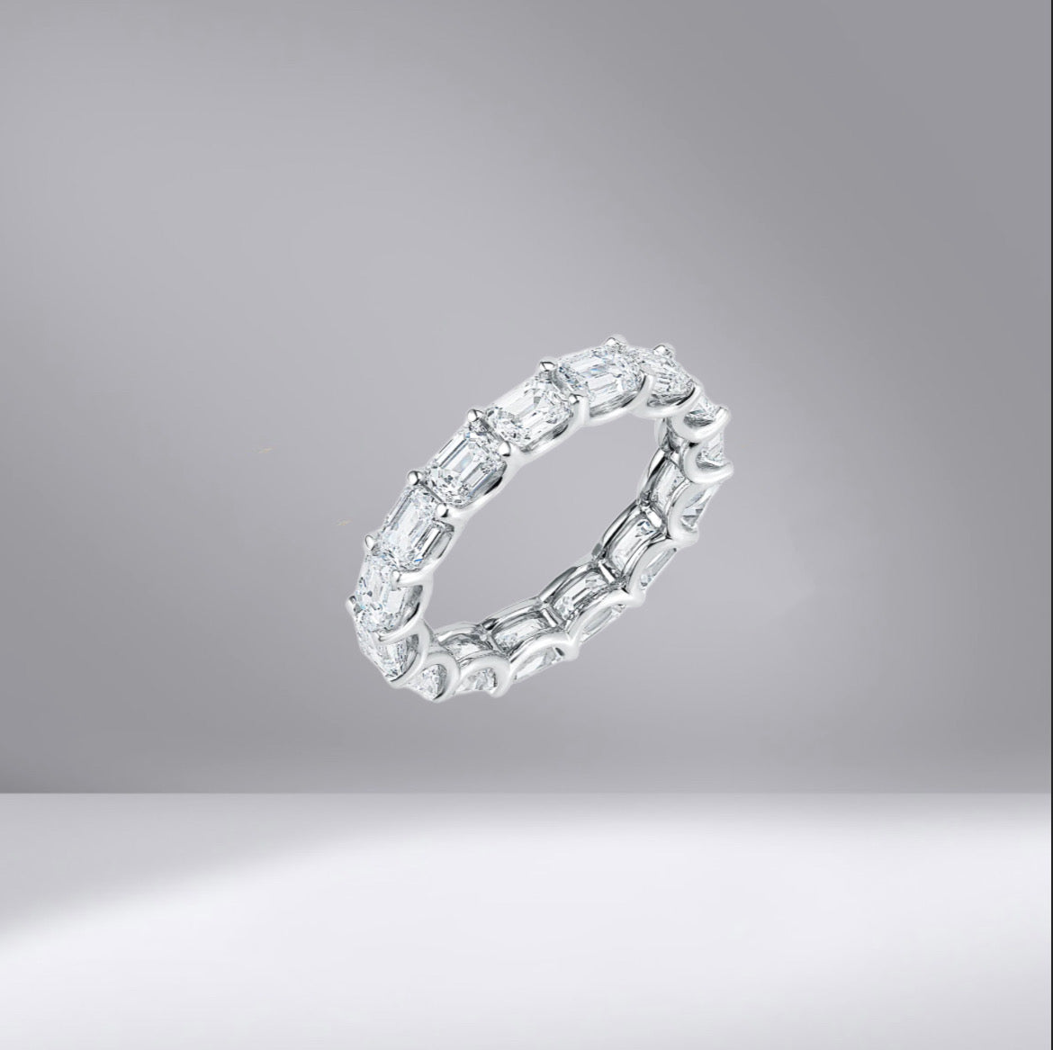 East-West Emerald Eternity Ring with sliver ring